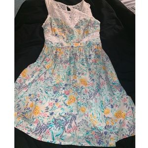 Delia’s floral dress with lace cutouts